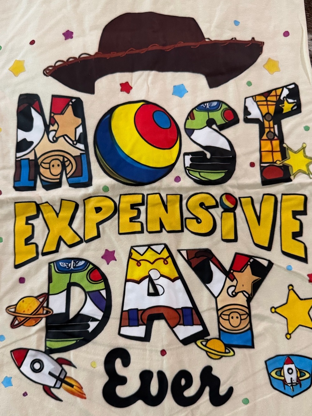 Toy Story 'Most Expensive Day Ever' NET Yellow Graphic short sleeve tee. Unisex